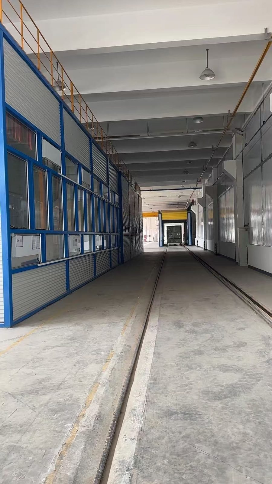 Rail corridor through a line of paint booths